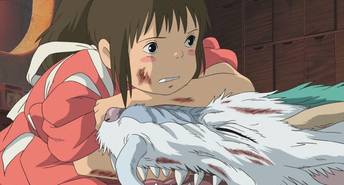 Chihiro force-feeding Haku magical medicine in Spirited Away